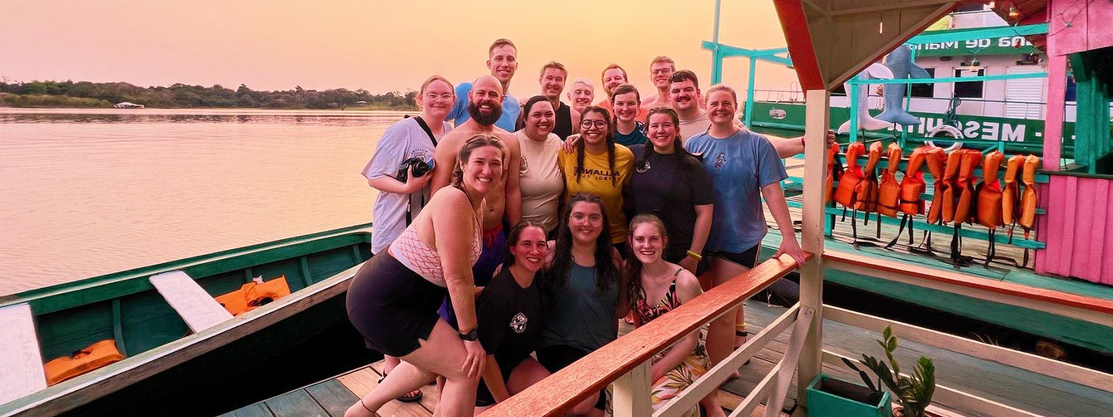 SBU students pose for photo with group of kids in Dominican Republic